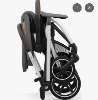 Silla de paseo Cybex gris y detalles naranja