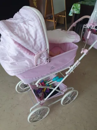 Cochecito de muñecas rosa