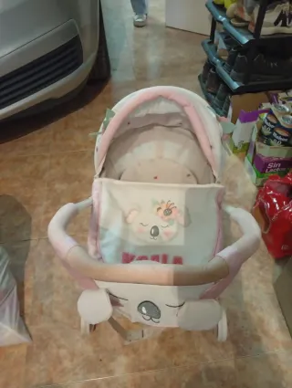 Silleta capota juguete rosa y blanco