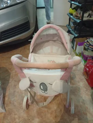 Silleta capota juguete rosa y blanco