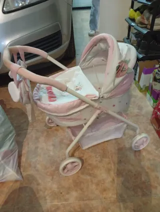 Silleta capota juguete rosa y blanco
