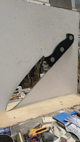 Specchio design coltello nero e argento