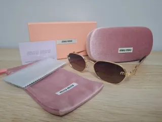 Occhiali da sole Miu Miu oro e marroni