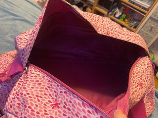 Bolsa de viaje infantil rosa con flores