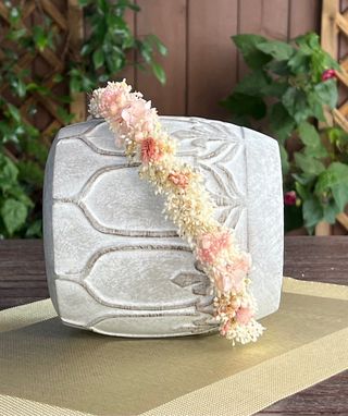 Corona de flores preservadas