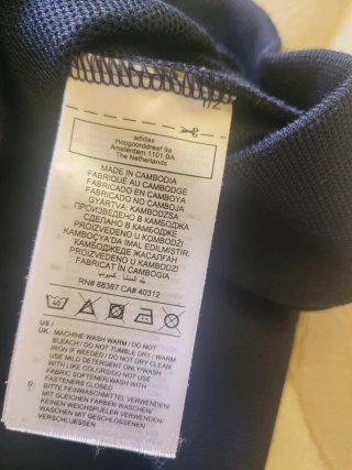 Tuta Adidas nera con logo