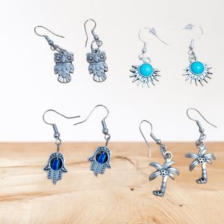 Pendientes de plata con diseño de búho, sol y mano