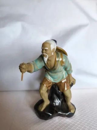 Figure di pescatori cinesi in ceramica