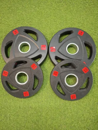 4 discos olímpicos 2 de 5kg y 2 de 2,5kg