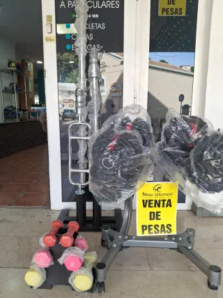 4 discos olímpicos 2 de 5kg y 2 de 2,5kg