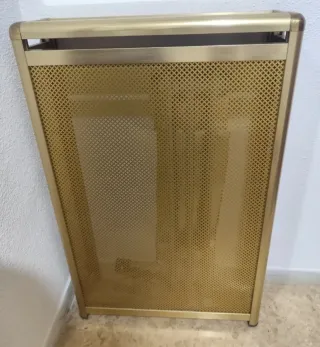 Cubre radiador dorado metal