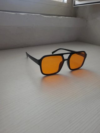 Occhiali da sole unisex neri lenti arancioni