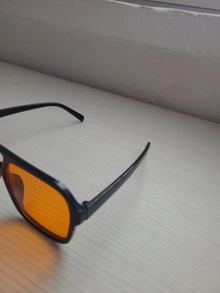 Occhiali da sole unisex neri lenti arancioni