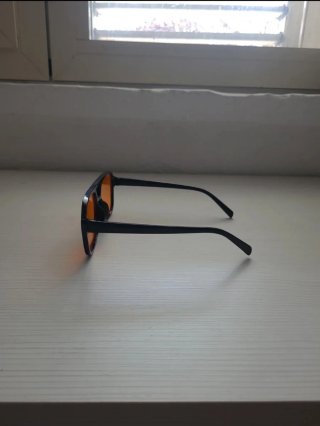 Occhiali da sole unisex neri lenti arancioni