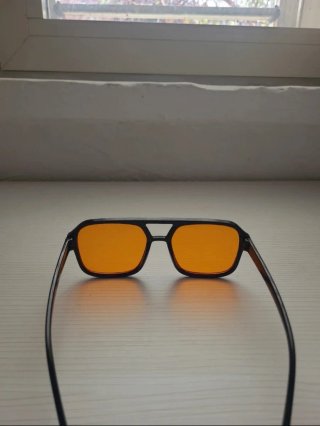 Occhiali da sole unisex neri lenti arancioni