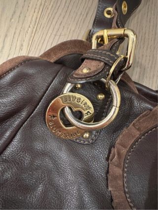 Borsa in pelle marrone con borchie