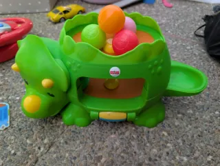 Juguete dinosaurio Fisher-Price con pelotas