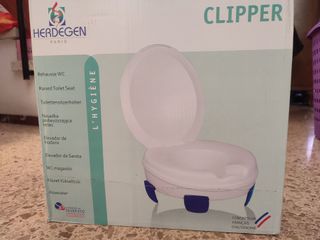 Asiento elevador inodoro movilidad reducida.