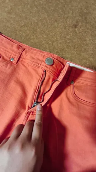Vaqueros cortos coral con flecos