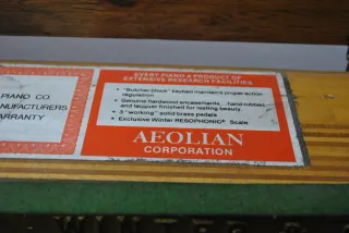 Antiguo piano Winter & Company con banqueta