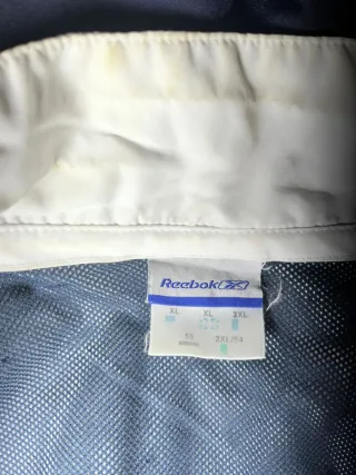 Cortavientos Reebok Azul y Blanco