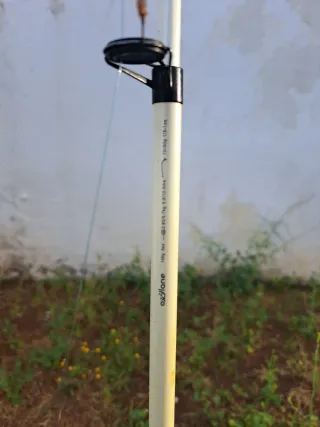 Caña de pescar con carrete y flotador