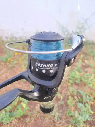 Caña de pescar con carrete y flotador