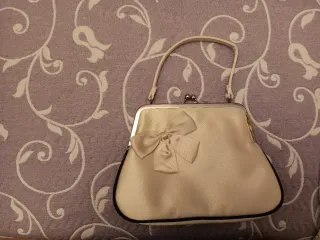 Bolso de mano beige con lazo Vintage
