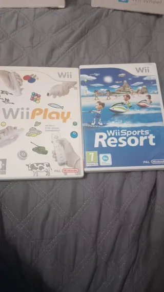 Nintendo Wii + 2 mandos + 2 volantes + 9 juegos