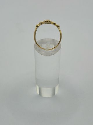 Anillo oro 18k flor central piedras