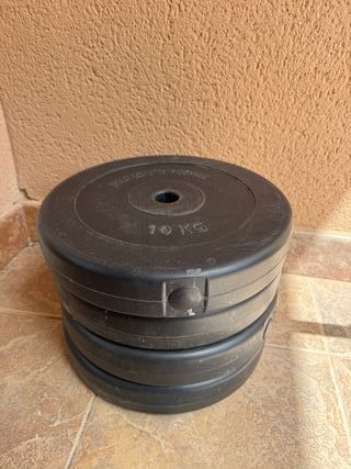 Barra y discos de pesas