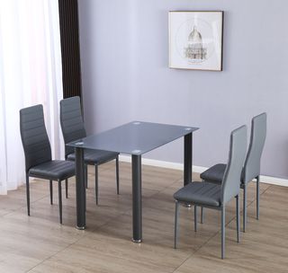 Mesa de cristal con 4 sillas blancas