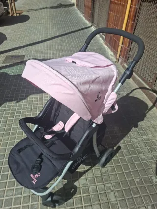 Carrito de bebé rosa y negro