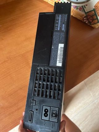 Consola PlayStation 2 con controles y juegos