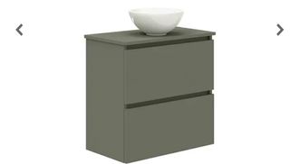 Lavabo y mueble de baño verde oscuro sin usar