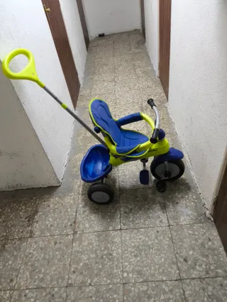 Triciclo evolutivo Juguettos azul y amarillo