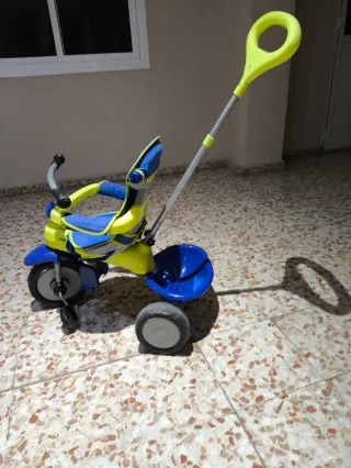 Triciclo evolutivo Juguettos azul y amarillo