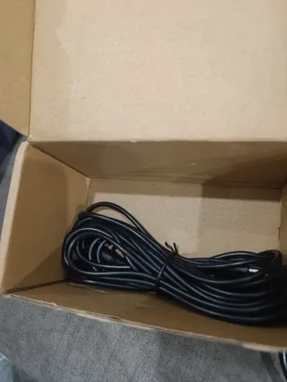 Cámara de seguridad verde con accesorios