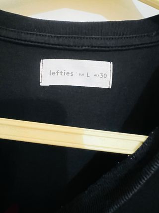 Camiseta negra mujer volantes