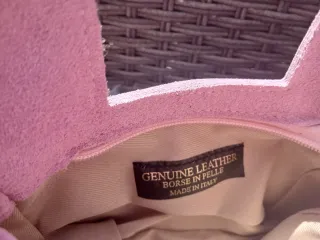 Borsetta in pelle rosa con frange