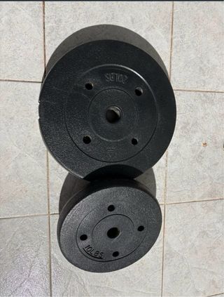 Banco de pesas con barra y discos