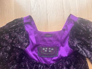 Casaca blusón morado y negro.