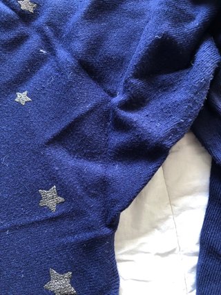 Maglia blu con stelline argentate