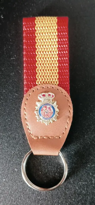Set Policía Nac.: Llavero, Bolí, Pin Pulsera Polié