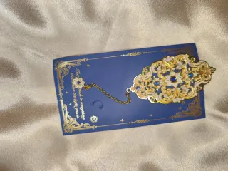 Marcador de libros vintage dorado con cadena