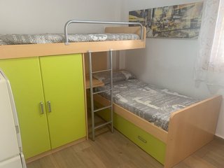 Litera y cama nido de madera y metal