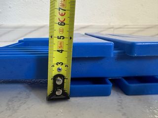 Taburete plegable azul para camping