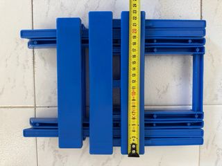 Taburete plegable azul para camping