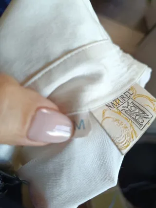 Camisa creme com originais botões