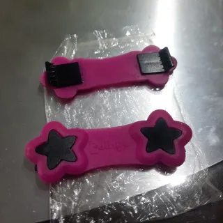 Fermapannolini rosa a forma di stella